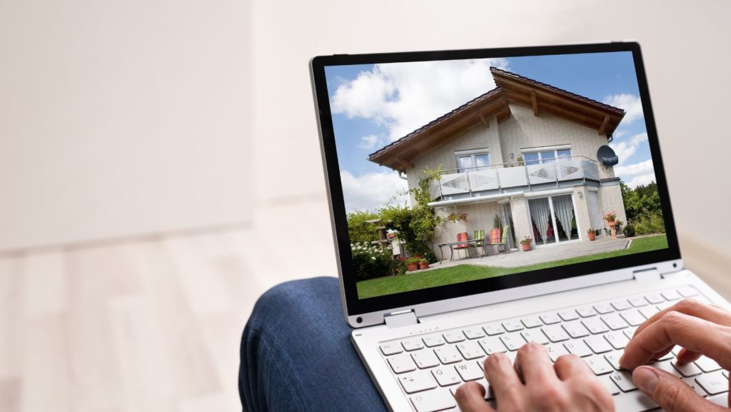 Person on computer viewing Property Portfolio